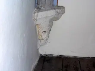 Cantoria (controfacciata), peduccio zoomorfo sinistro - Cappella di San Cristoforo o dell'Annunziata a SalbertrandFrazione Oulme